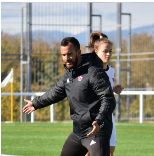 Elevate coach working with a soccer player during an individual training session